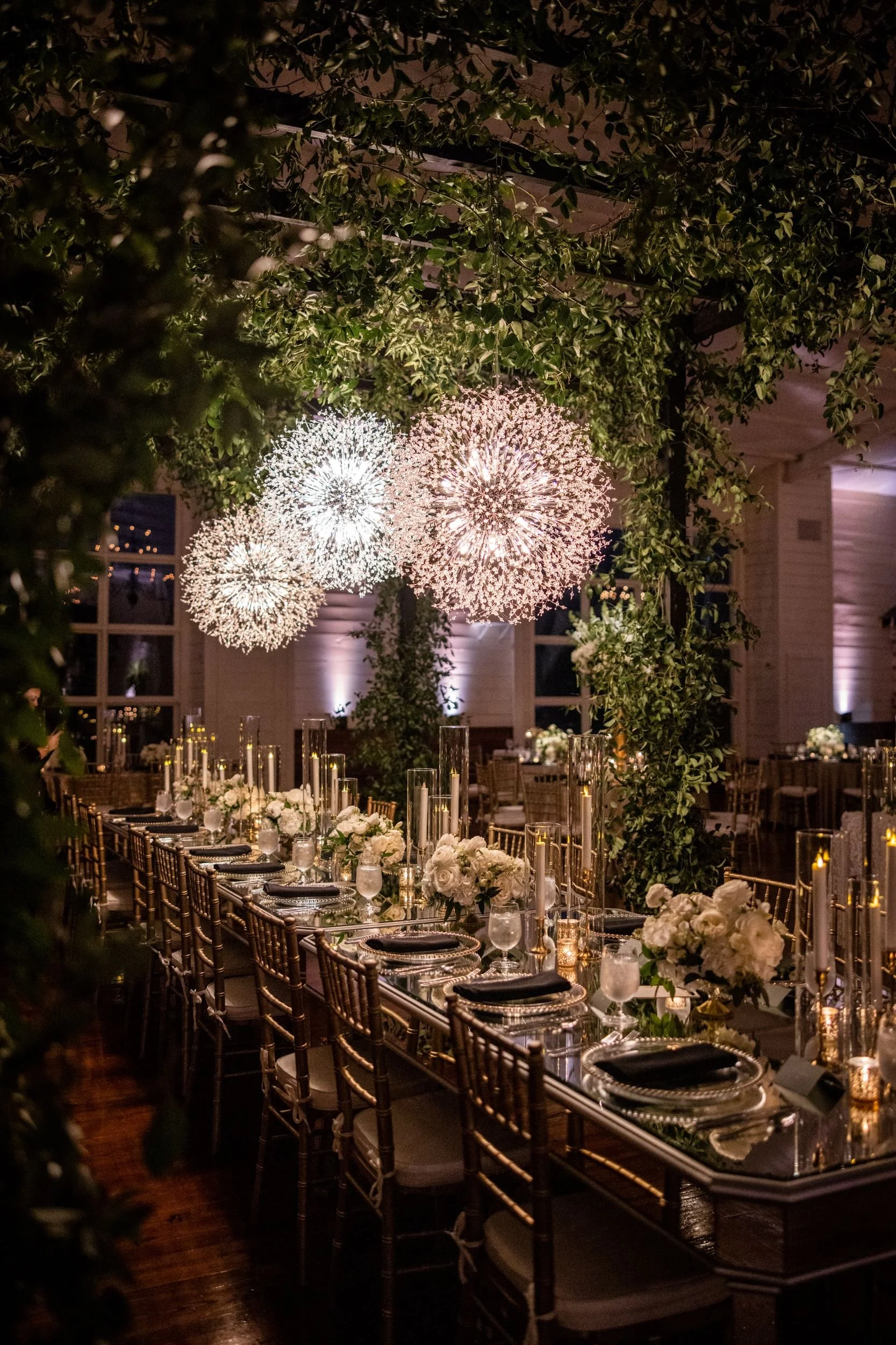 wedding reception dinner under floral chandelier at the jefferson oxford ms