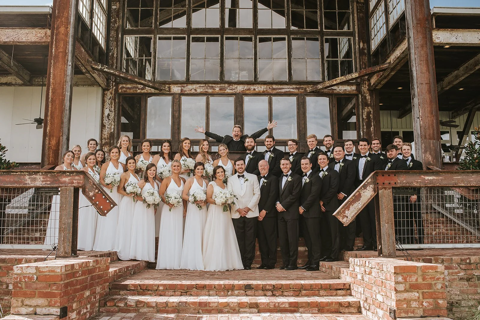 large bridal party on lakefront stairway wedding reception jefferson oxford ms