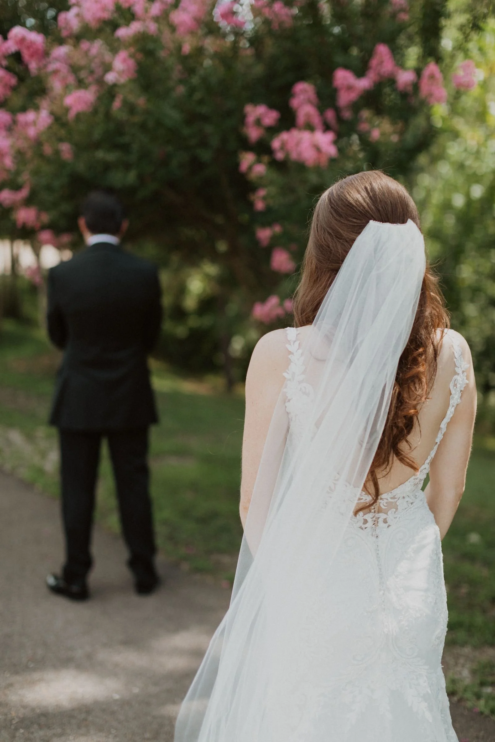 first look for bride & groom in front of crepe myrtle at Jefferson oxford