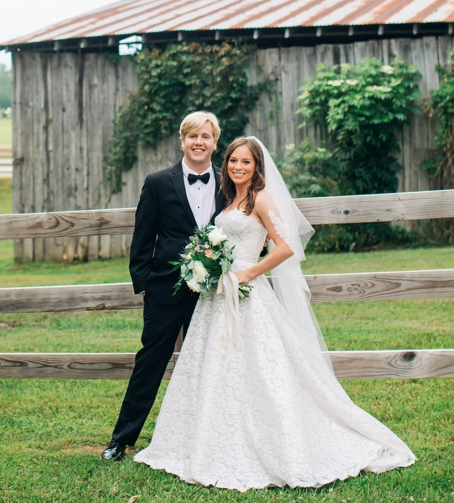 couple wedding day in front of barn at jefferson oxford ms