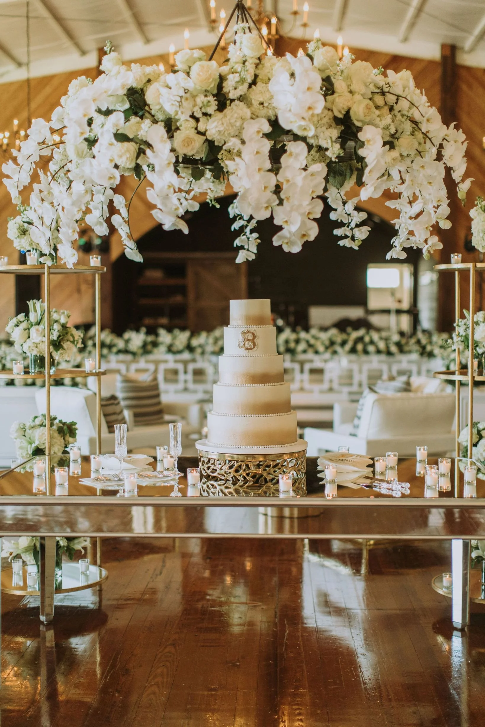 orchid floral chandelier hanging above a cake in Jefferson Oxford Grand Hall