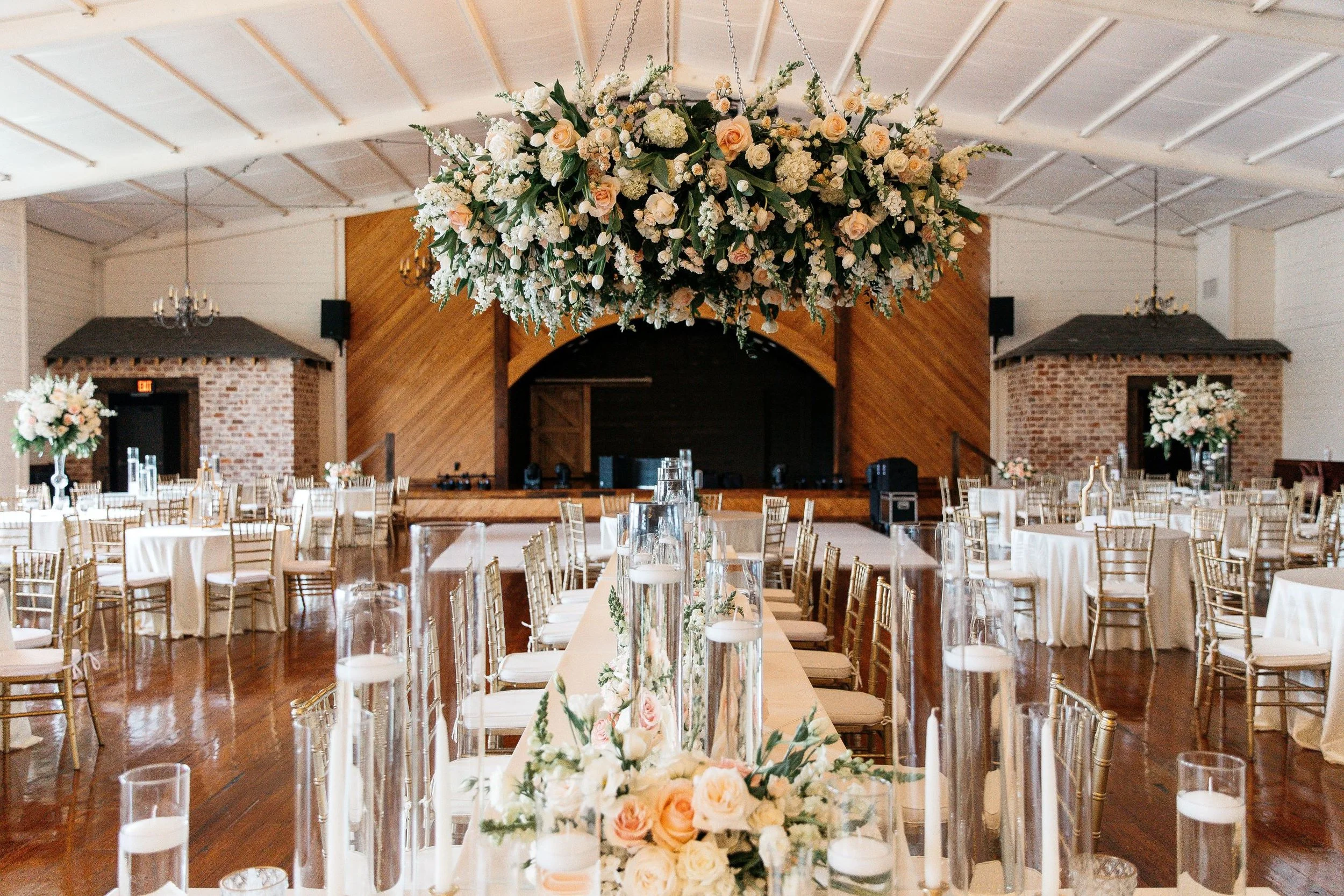 floral chandelier over wedding reception head table at Jefferson Oxford MS
