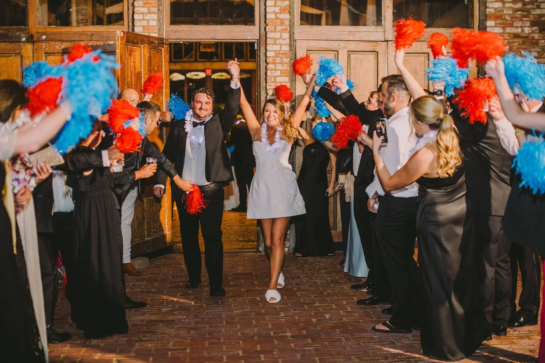 couple wedding send-off with pompoms from reception at Jefferson Oxford MS