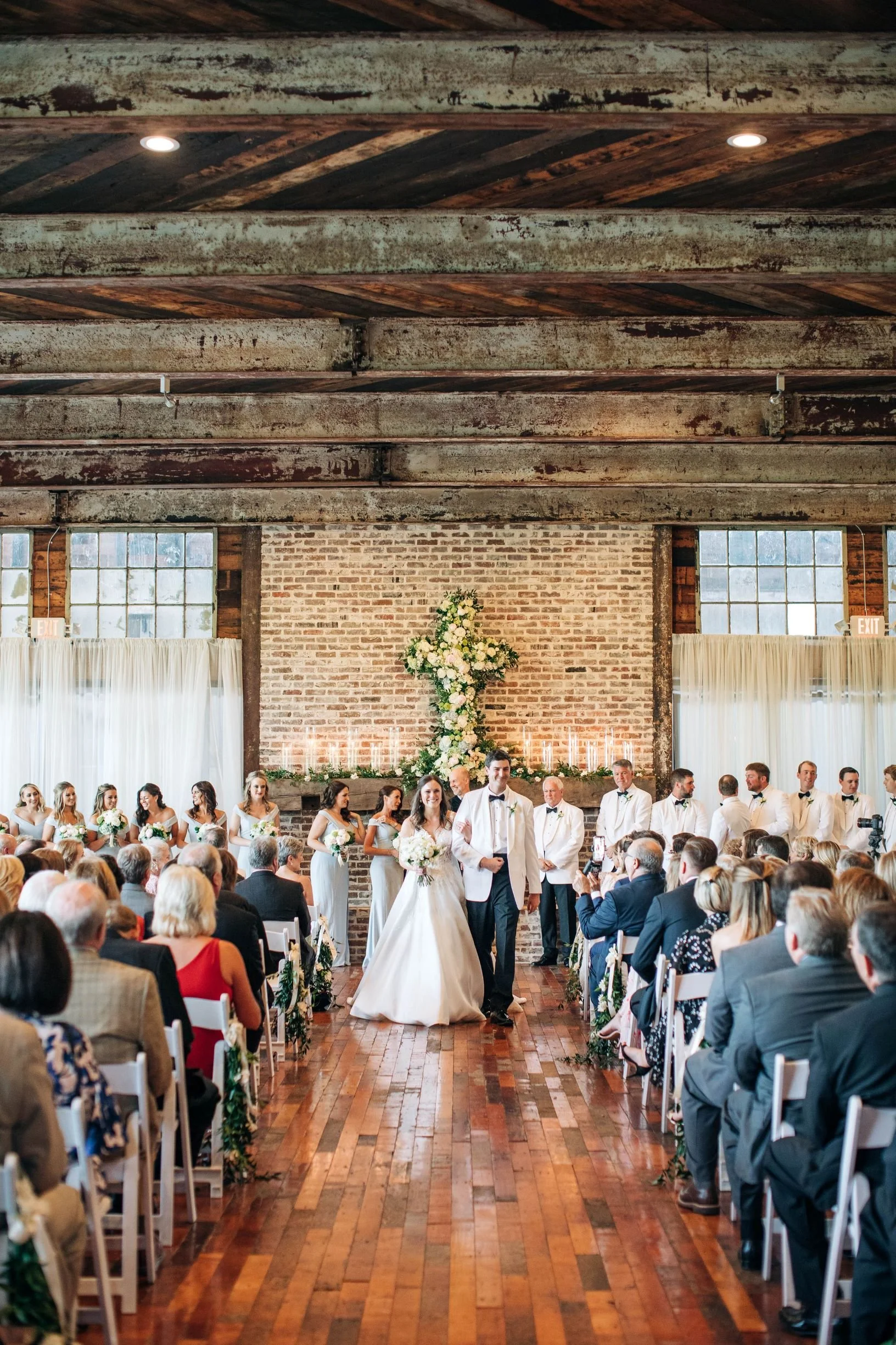 couple during recessional from wedding ceremony in Lakeside Room at The Jefferson Oxford