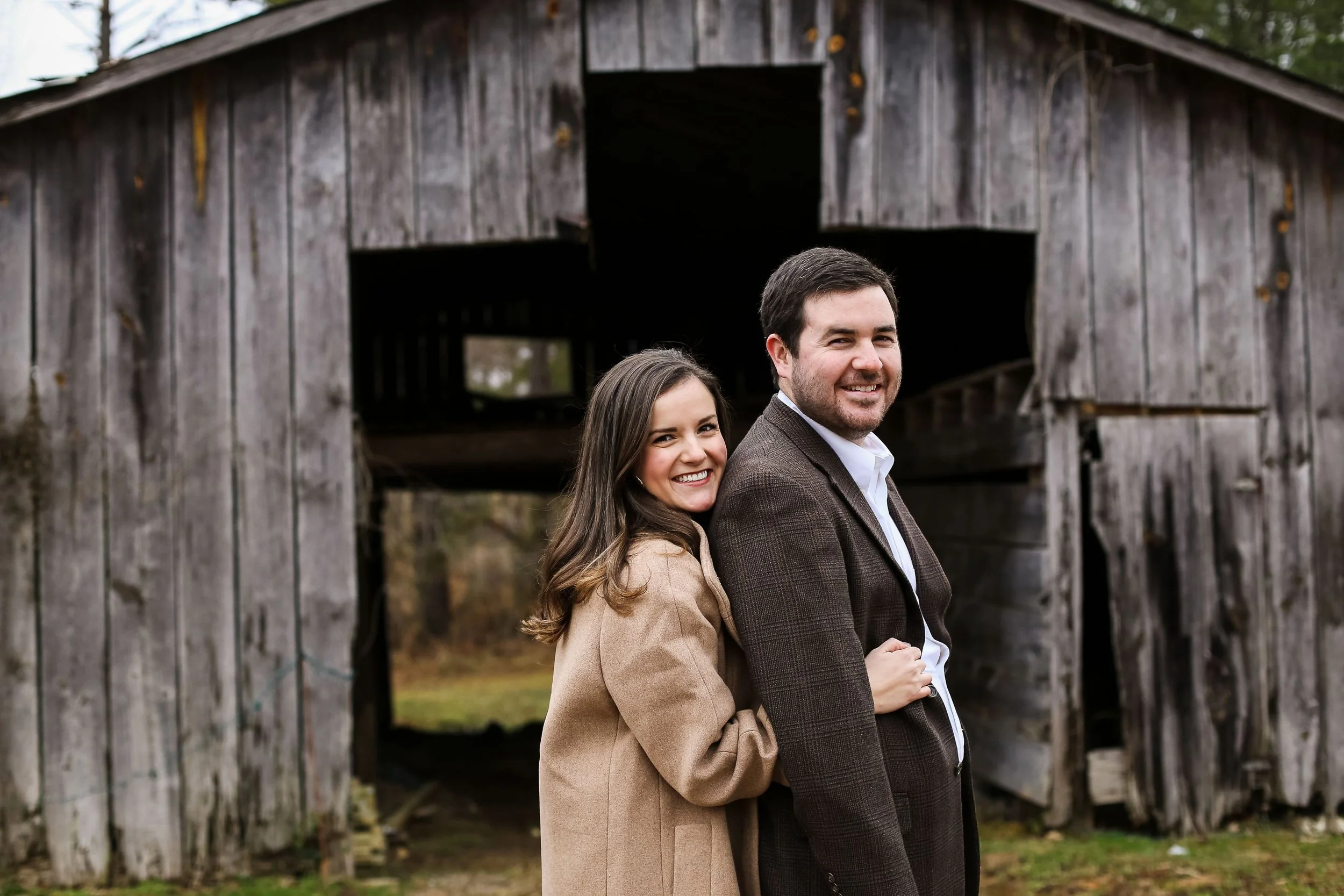 engagement photo in front of barn at jefferson oxford