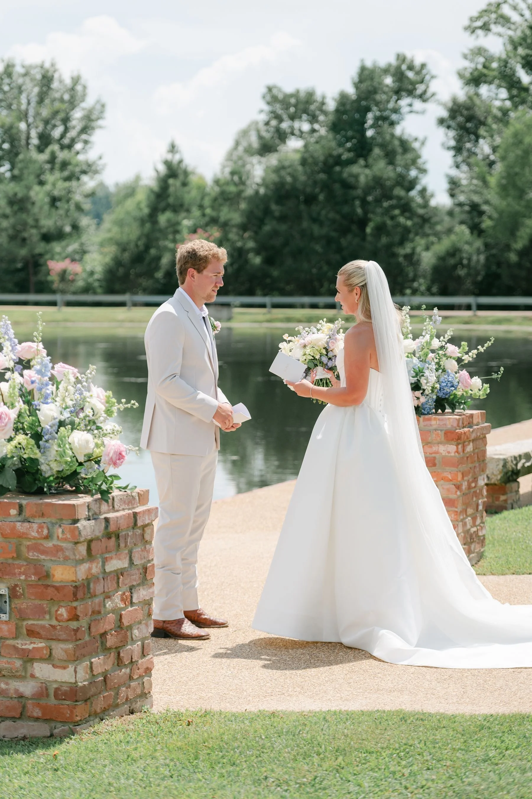 first look bride and groom lakefront walkway at The Jefferson Oxford