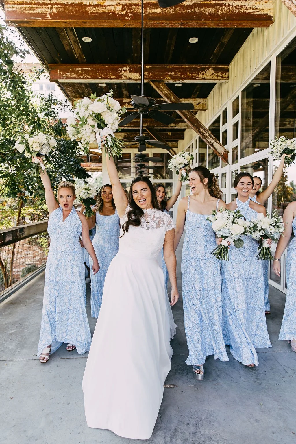 bride and bridesmaids cheering outside at the jefferson oxford ms