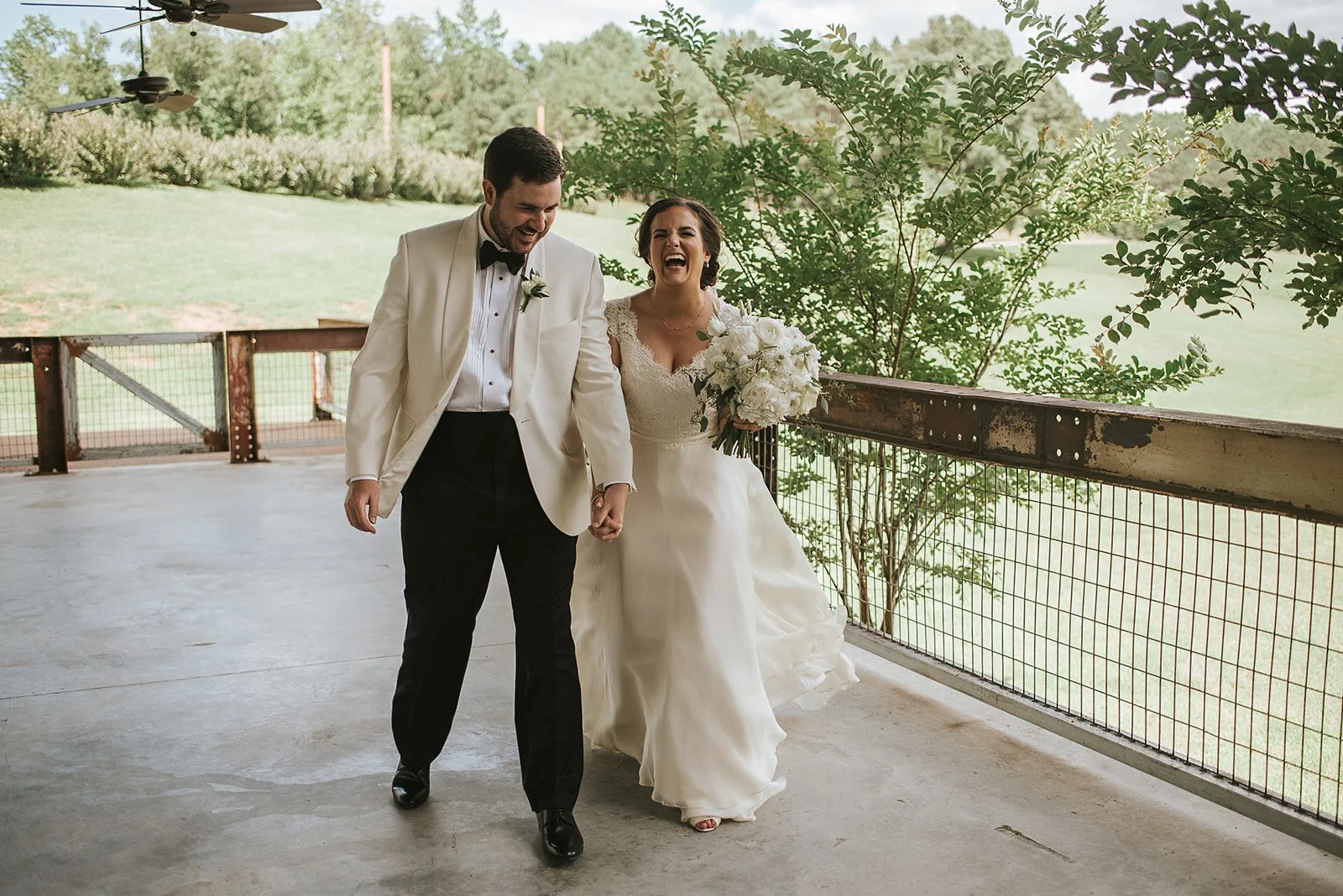 elated couple leaving wedding ceremony at the jefferson oxford MS