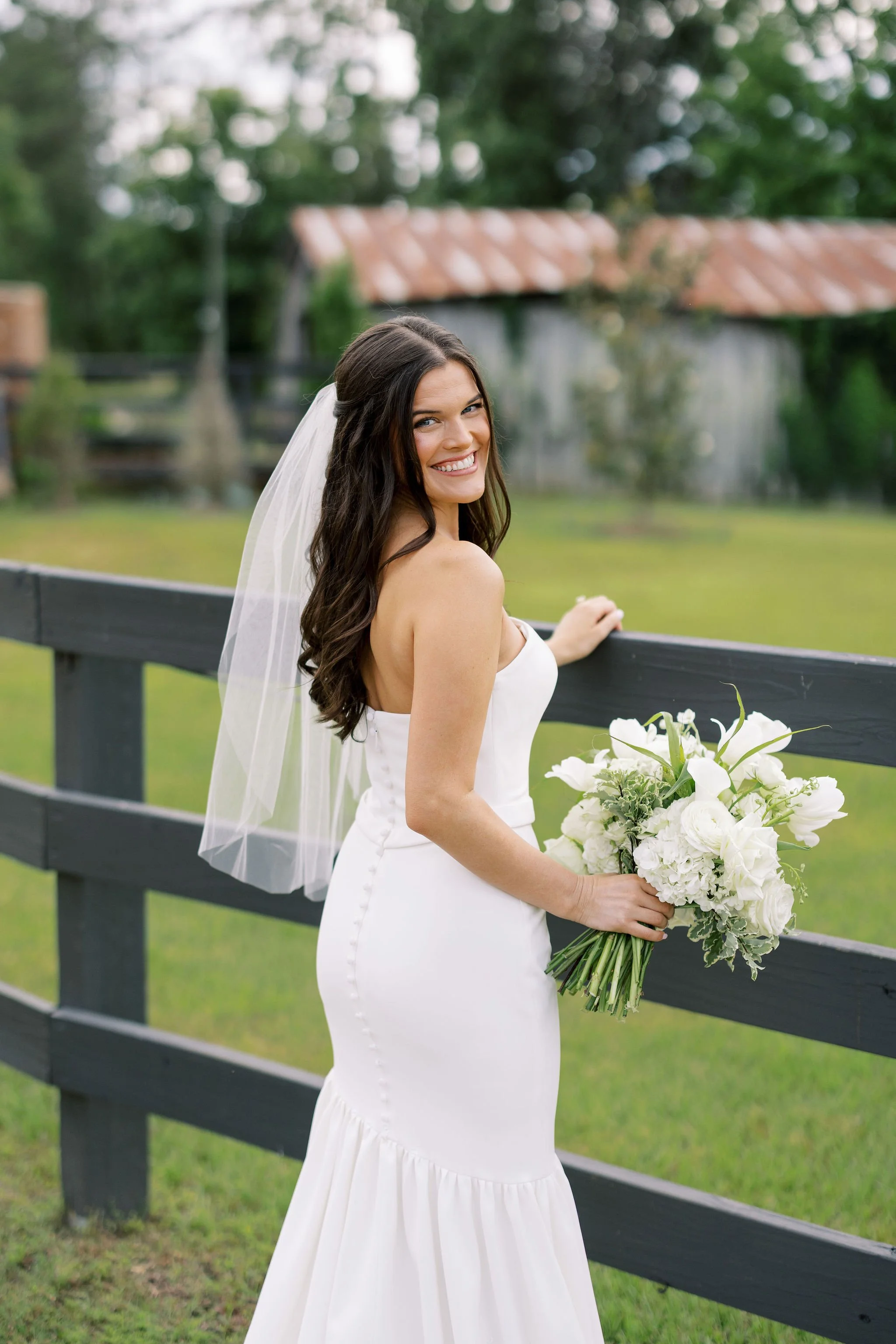 bride wedding day in front of barn at jefferson oxford ms