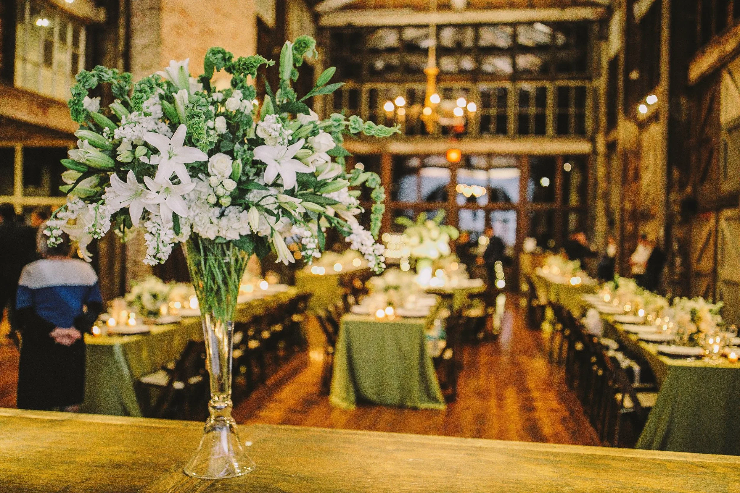 Faulkner Room set for lovely rehearsal dinner at Jefferson with long rectangular tables