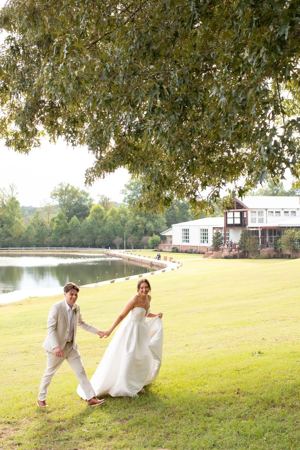 couple with lake background under large tree at Jefferson oxford MS