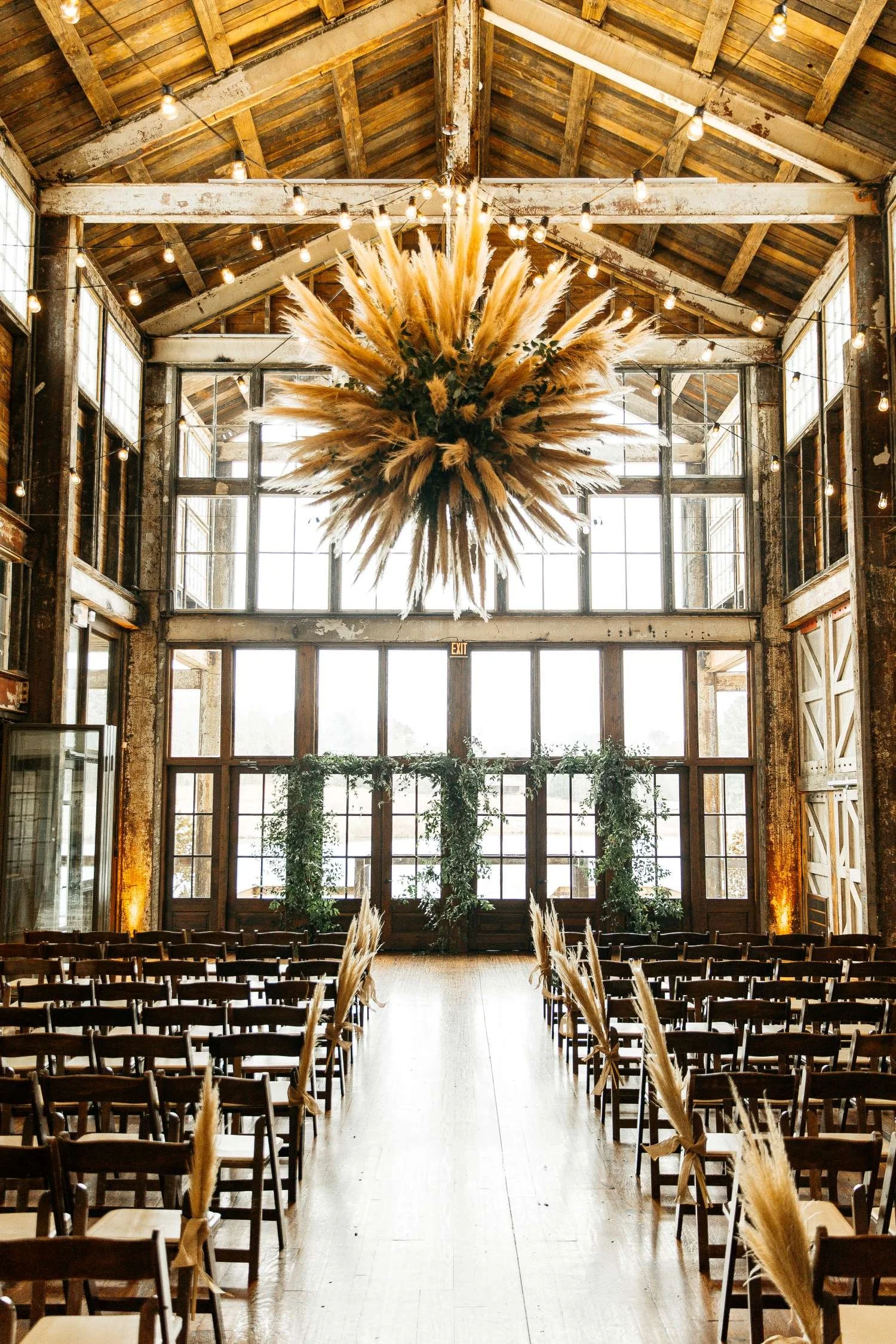 Faulkner Room wedding ceremony with floral chandelier at Jefferson Oxford