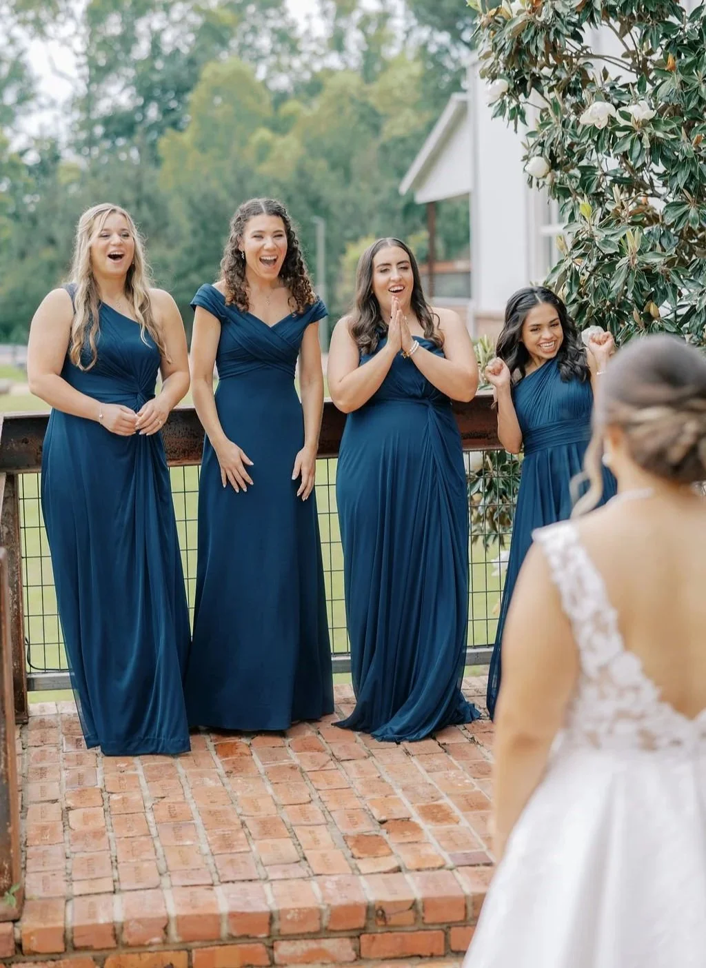 first look bride and bridesmaids lakefront stairway at The Jefferson Oxford