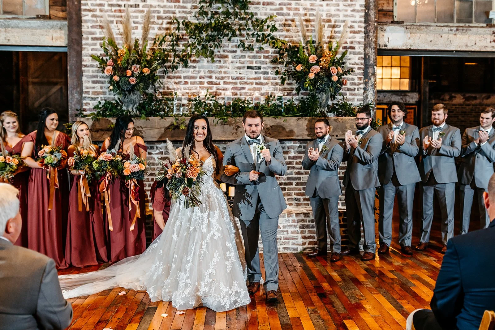 couple during recessional from wedding ceremony in Lakeside Room at The Jefferson Oxford