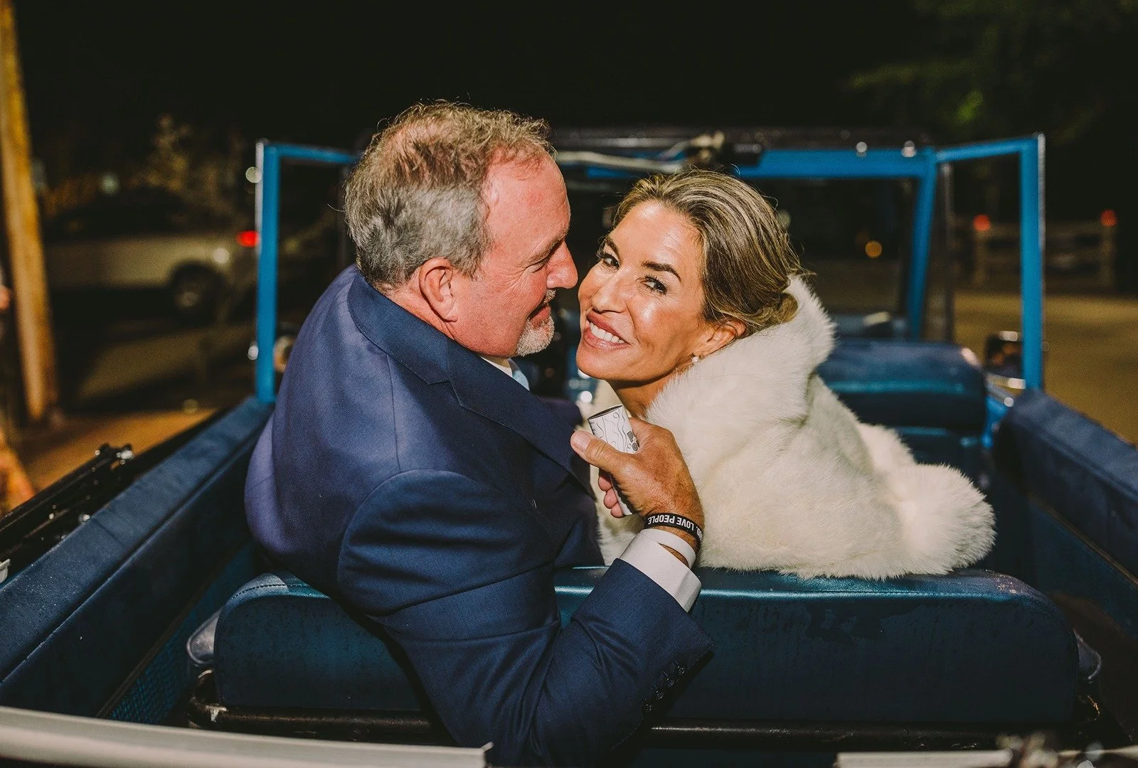 bride and groom in antique convertible for wedding send-off at The Jefferson Oxford