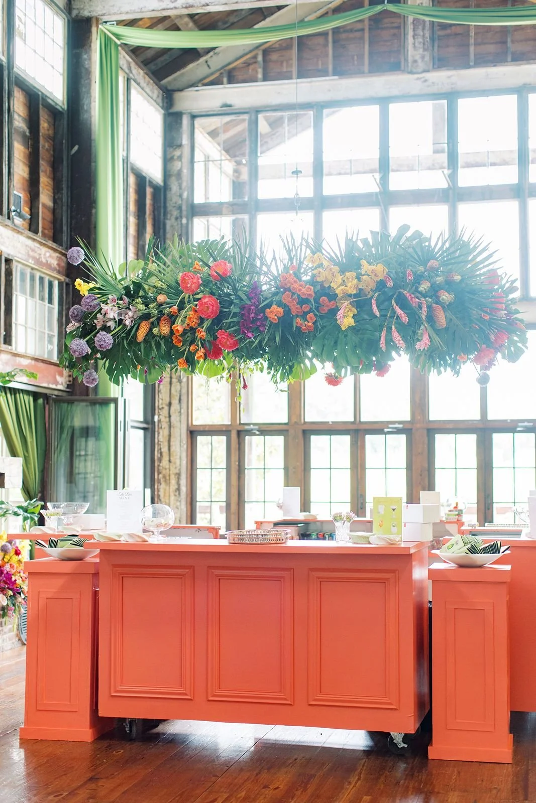 colorful floral chandelier over a colorful bar at the Jefferson oxford ms