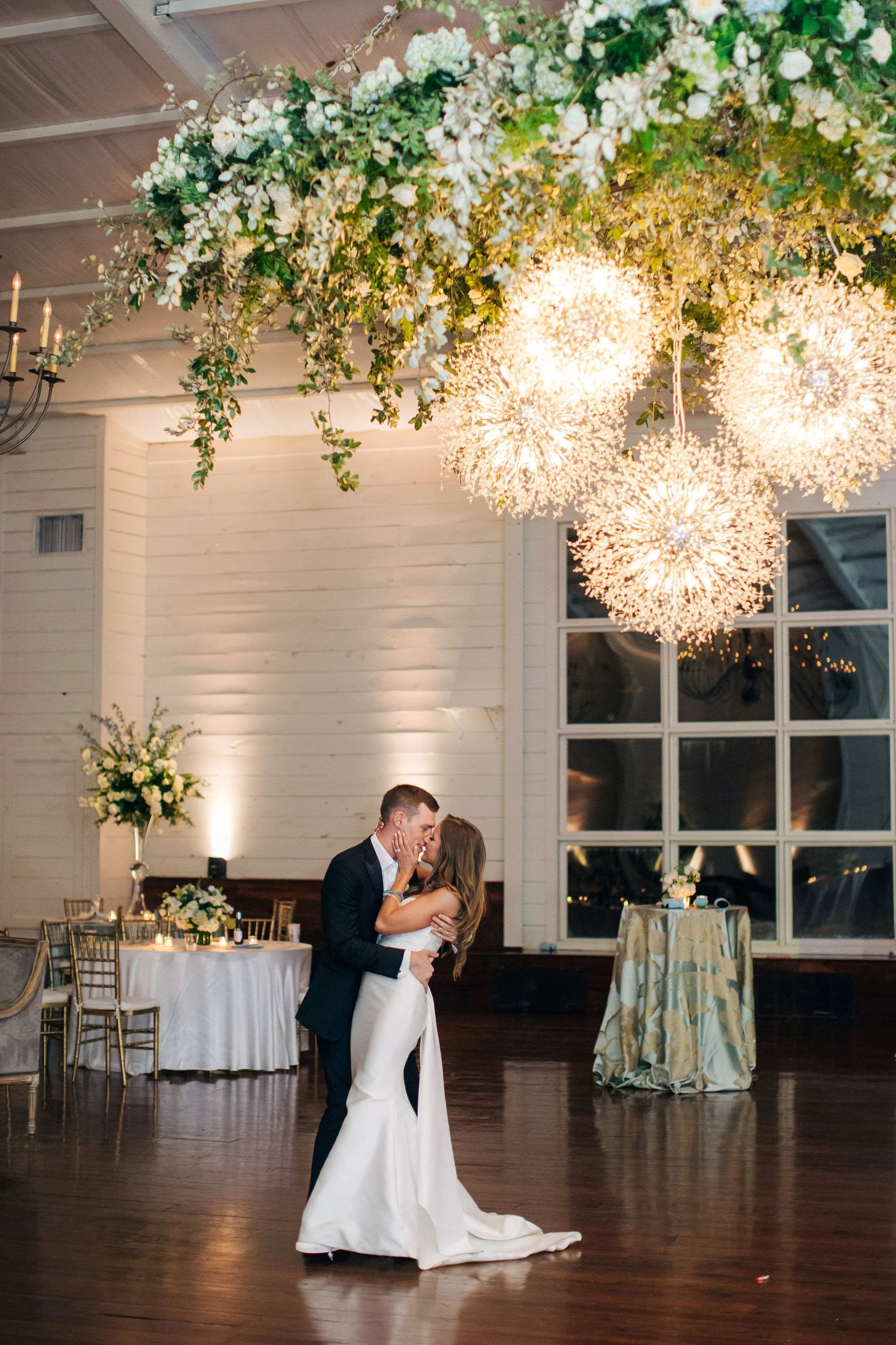 sparkling floral chandelier with lighted orbs hanging above dance floor in grand hall jefferson oxford wedding.jpg