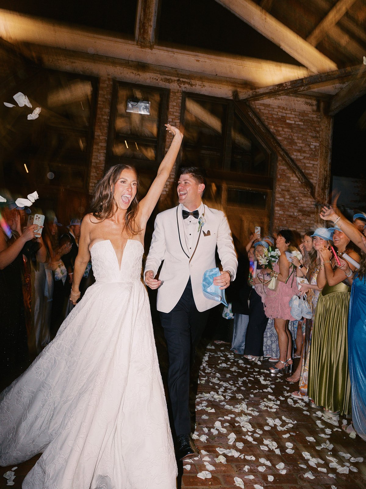 couple showered with flower petals at wedding send-off at The Jefferson Oxford
