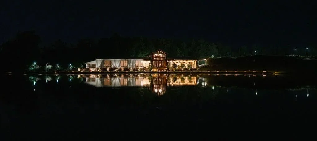 view of the venue at night from across the lake at the jefferson oxford