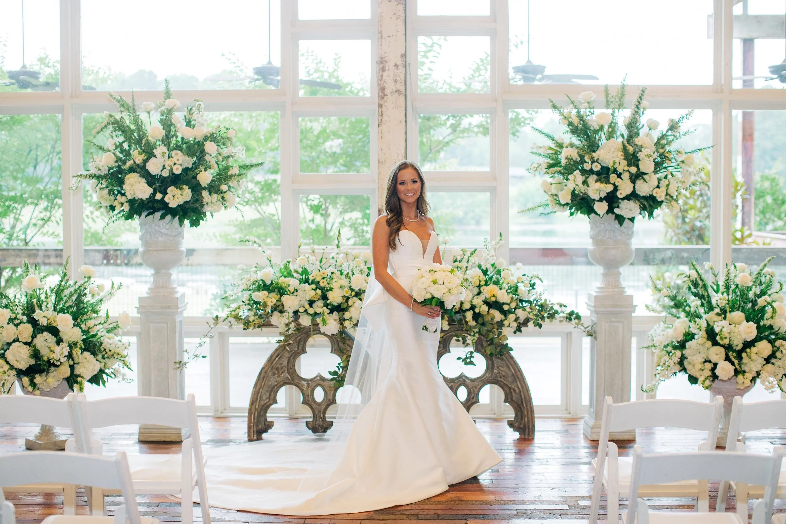 bride with floral before a wedding ceremony in the lakeside room at the Jefferson Oxford