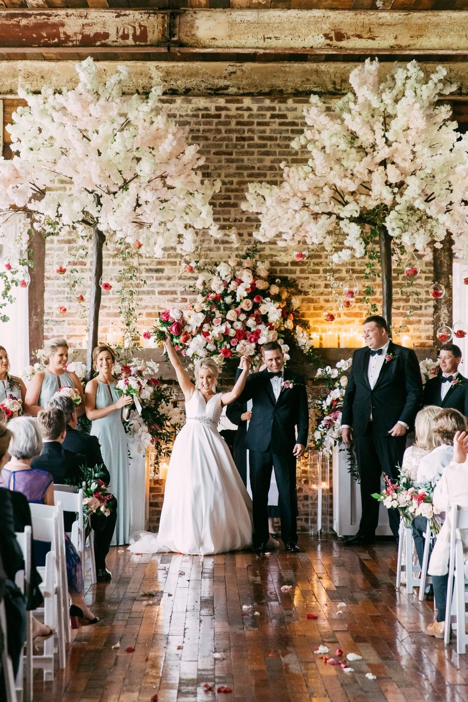 couple at end of wedding ceremony with gorgeous floral in Lakeside Room at The Jefferson Oxford