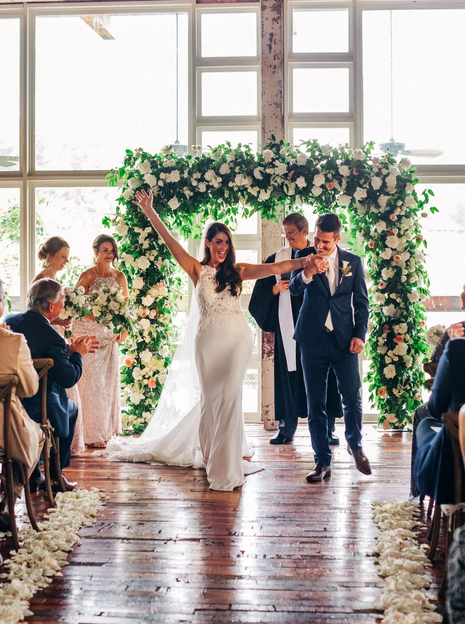 a couple at the end of wedding ceremony in the lakeside room at the Jefferson Oxford