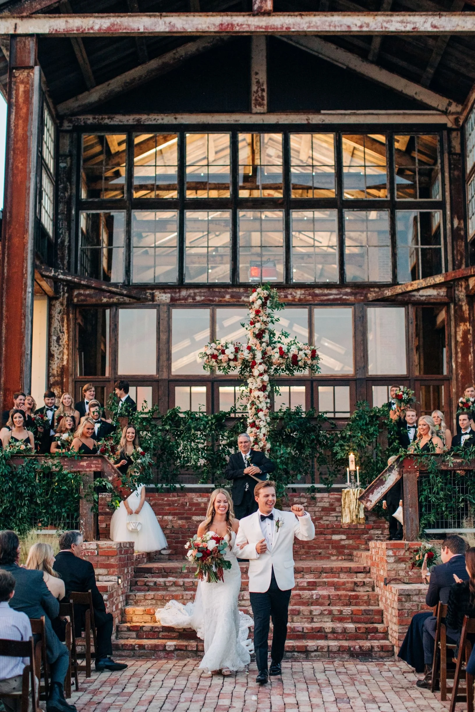 outside ceremony with floral cross on lakefront stairs at The Jefferson Oxford