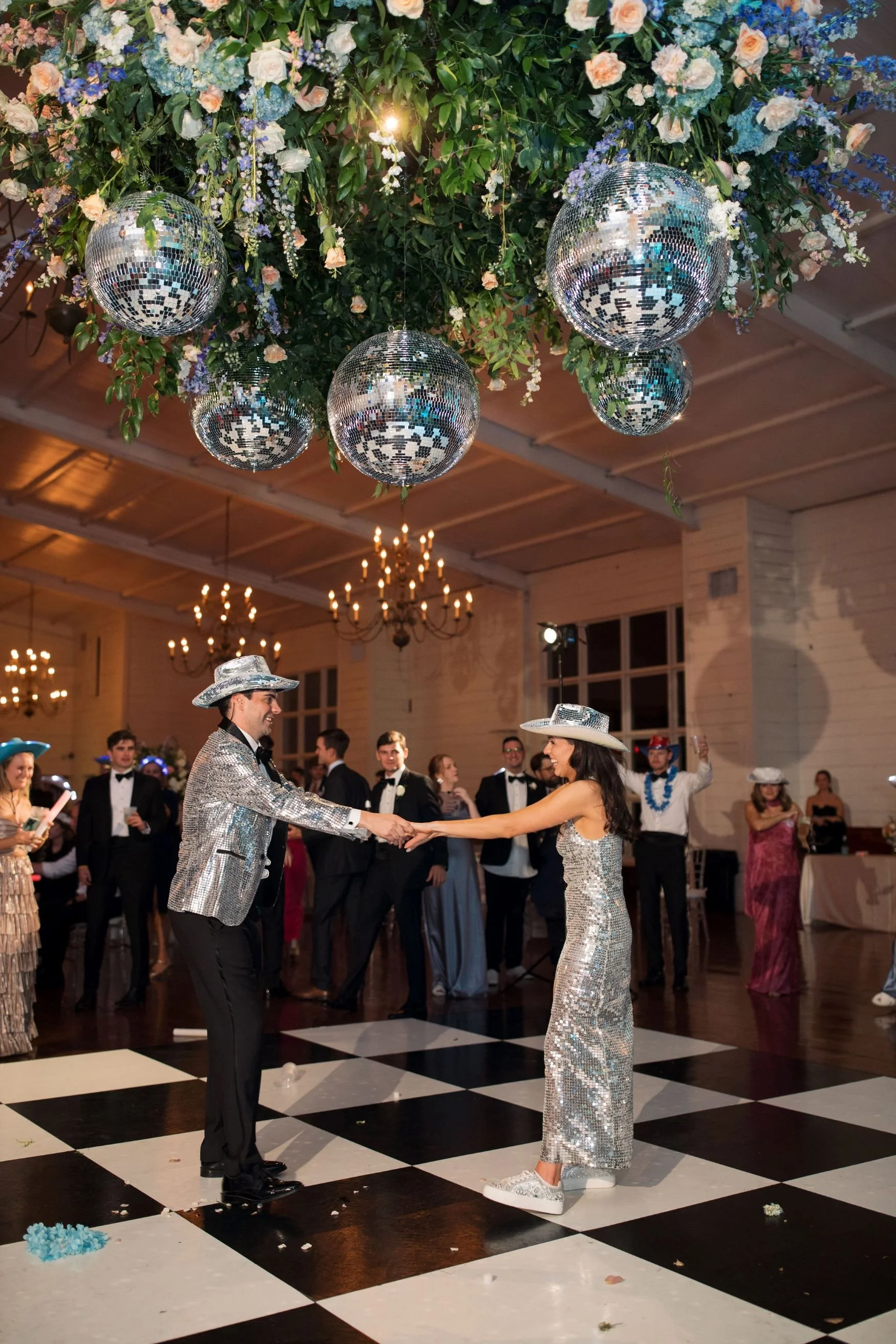 colorful floral chandelier with orbs hanging above dance floor in grand hall jefferson oxford wedding.jpg