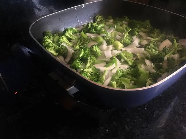 Heat sesame oil in electric skillet, wok, or wide bottomed skillet on high. Toss in the veg when the oil ripples, and allow to cook for 3-4 minutes. I love some charred bits, stir often.