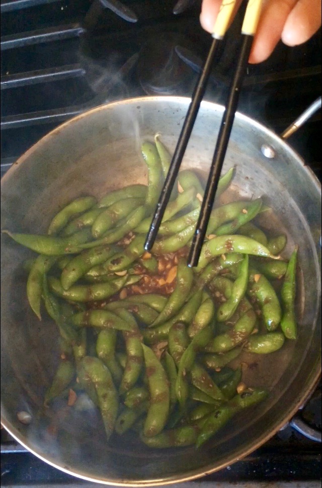 Add sauce to coconut oil and blistered edamame, stir to combine, cook 1-2 to get sticky