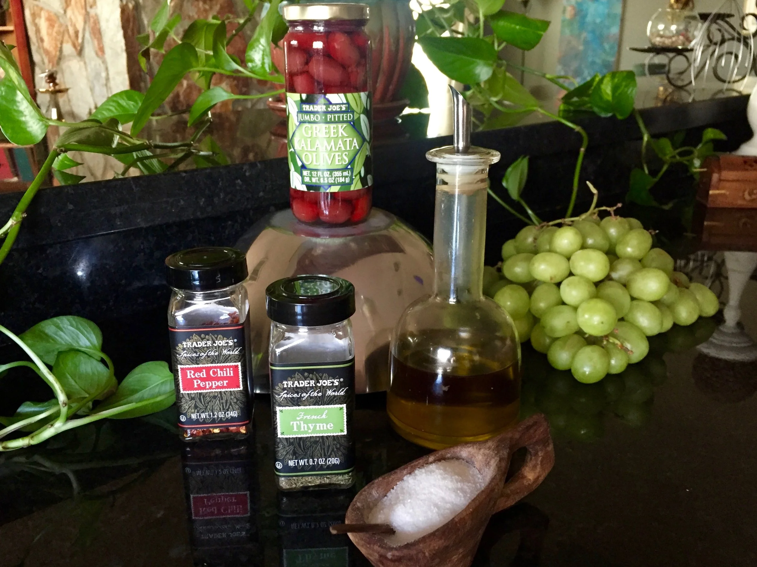 Setup : kalamata olives, green grapes, olive oil, salt, thyme, red chili pepper flakes