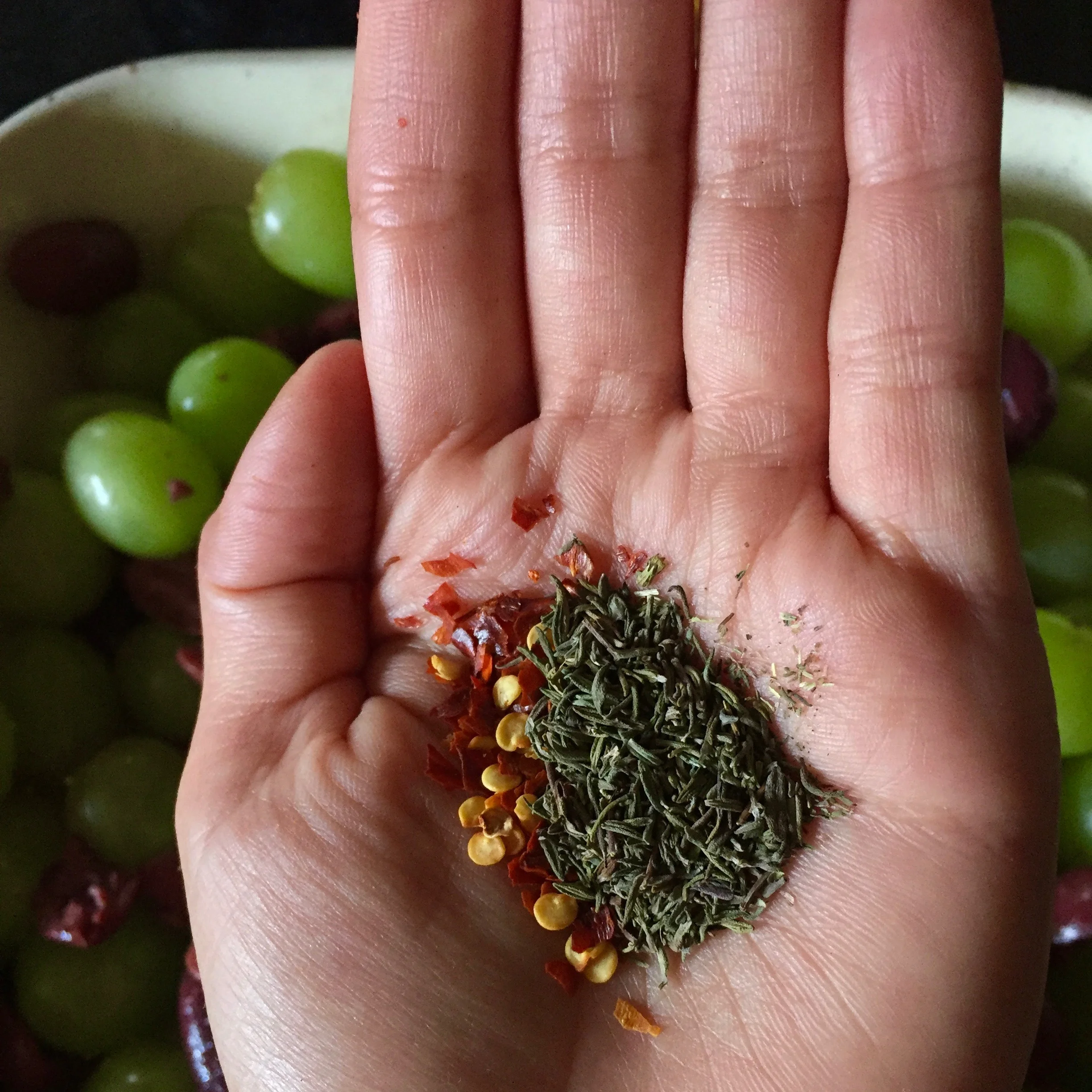Crumble the thyme, a rough chop, if you're using fresh, salt, and red pepper flake. Sprinkle over mixture.