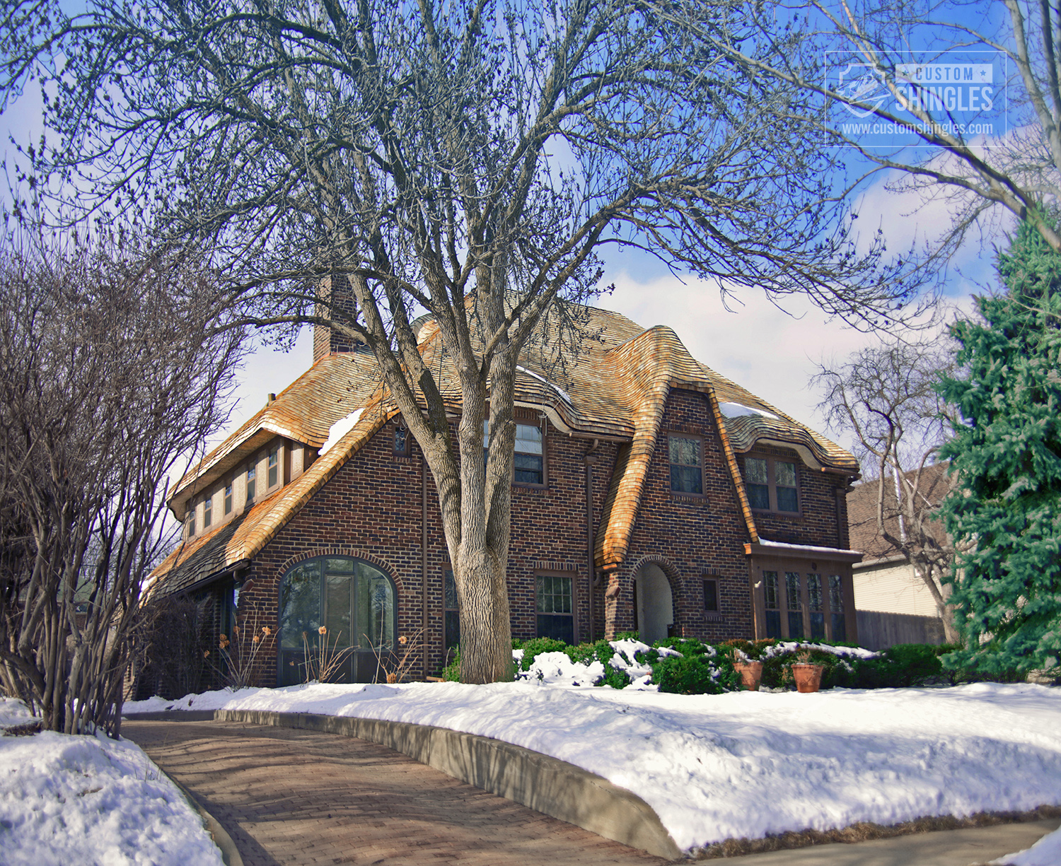 storybook house bent shingle roof
