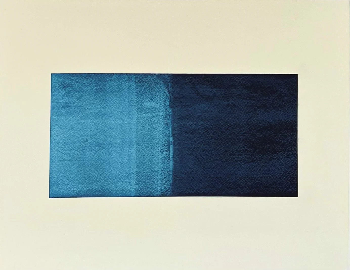 A rectangular image divided vertically into two halves. The left side is a gradient of bright blue, and the right side is a darker blue, almost navy, with the gradient blending in the middle.