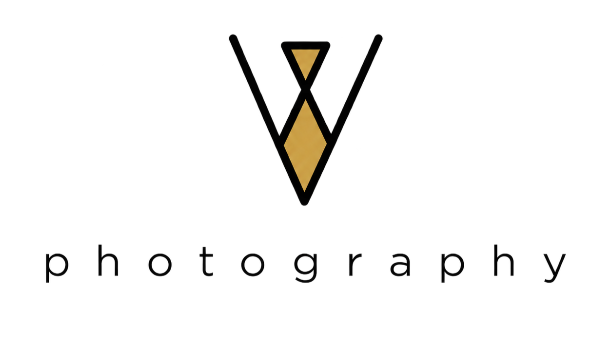 A black background with a gold diamond and triangle logo in the center.