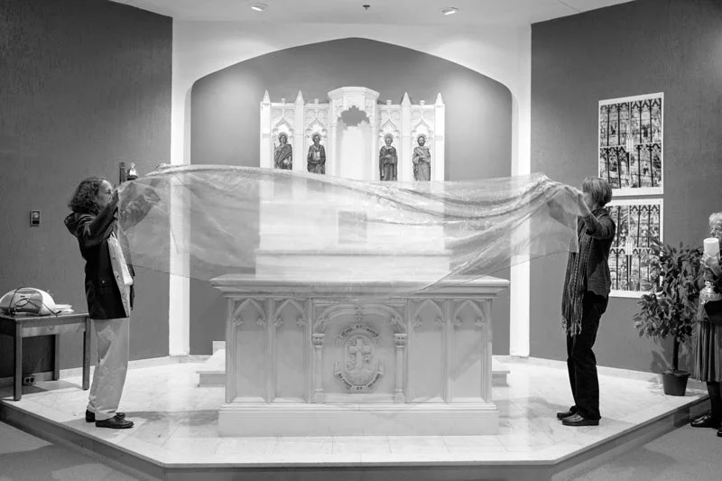 Rev. Barbara Belly (on the right) preparing the table for Holy Mass with the help of other women, in Windsor Ontario. (Canada, 2015)