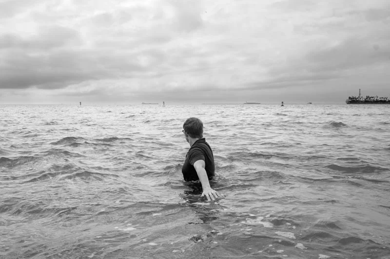 Rev. Jen O' Malley in the water in Long Beach bay, California. She holds a Masters of Pastoral Studies from Loyola University Chicago. Before being excommunicated she worked as a Coordinator of Youth ministry at a parish in the archdiocese of Los Angeles and was a program director for a national Catholic service learning program. Today Jen is also chapter leader of Call To Action Los Angeles, a national organisation seeking renewal in the Catholic Church in the States. She's also involved with Future Church and Pride, for the inclusion of LGBT members in Catholic communities without condemnation. (United States, 2015)