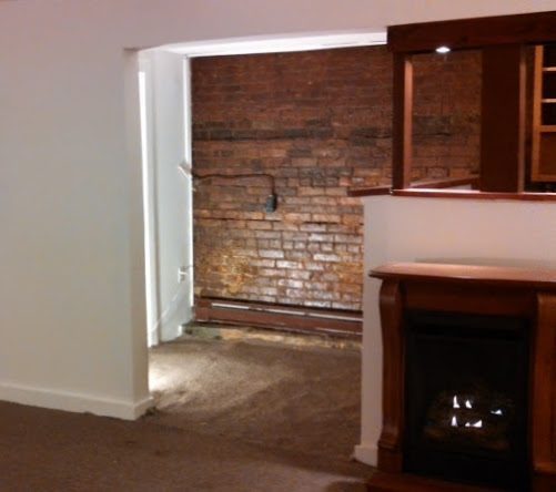 137 bsmt fireplace entry.jpg