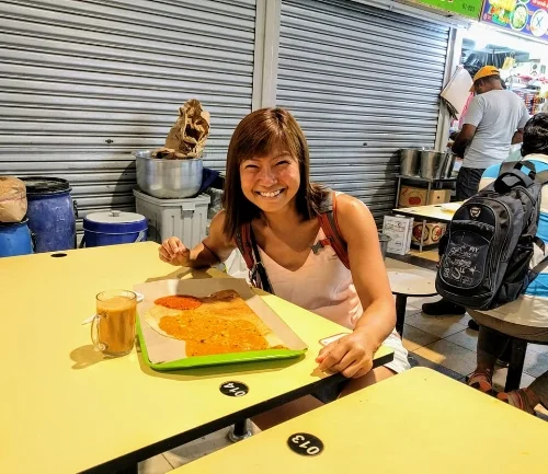 Enjoying my thosai and teh tarik halia (ginger milk tea) in Tekka food center
