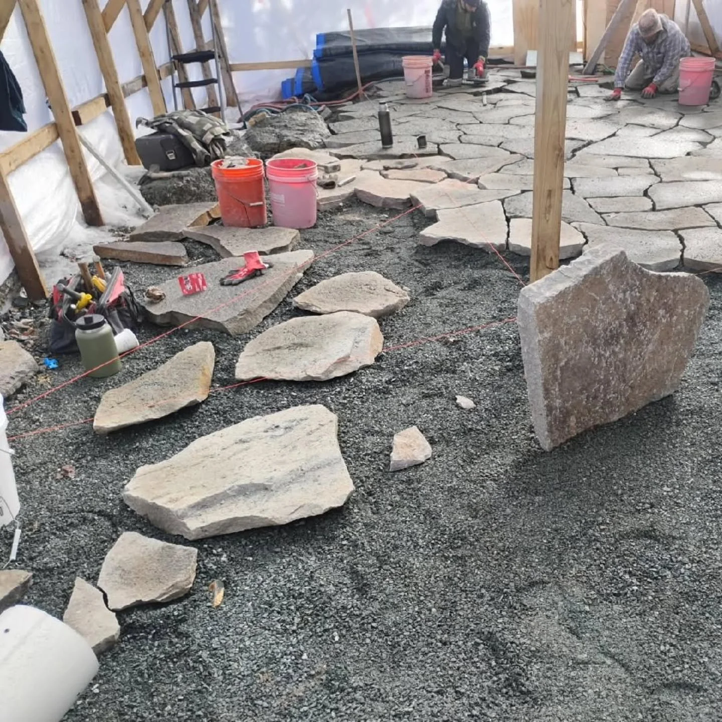 We get asked all the time, "What do you do in the Winter". Well, we build shelter tents and do stonework, of course! #stonework #granite #patio #winter #mountdesertisland #maine  #acadia @acadialandscape