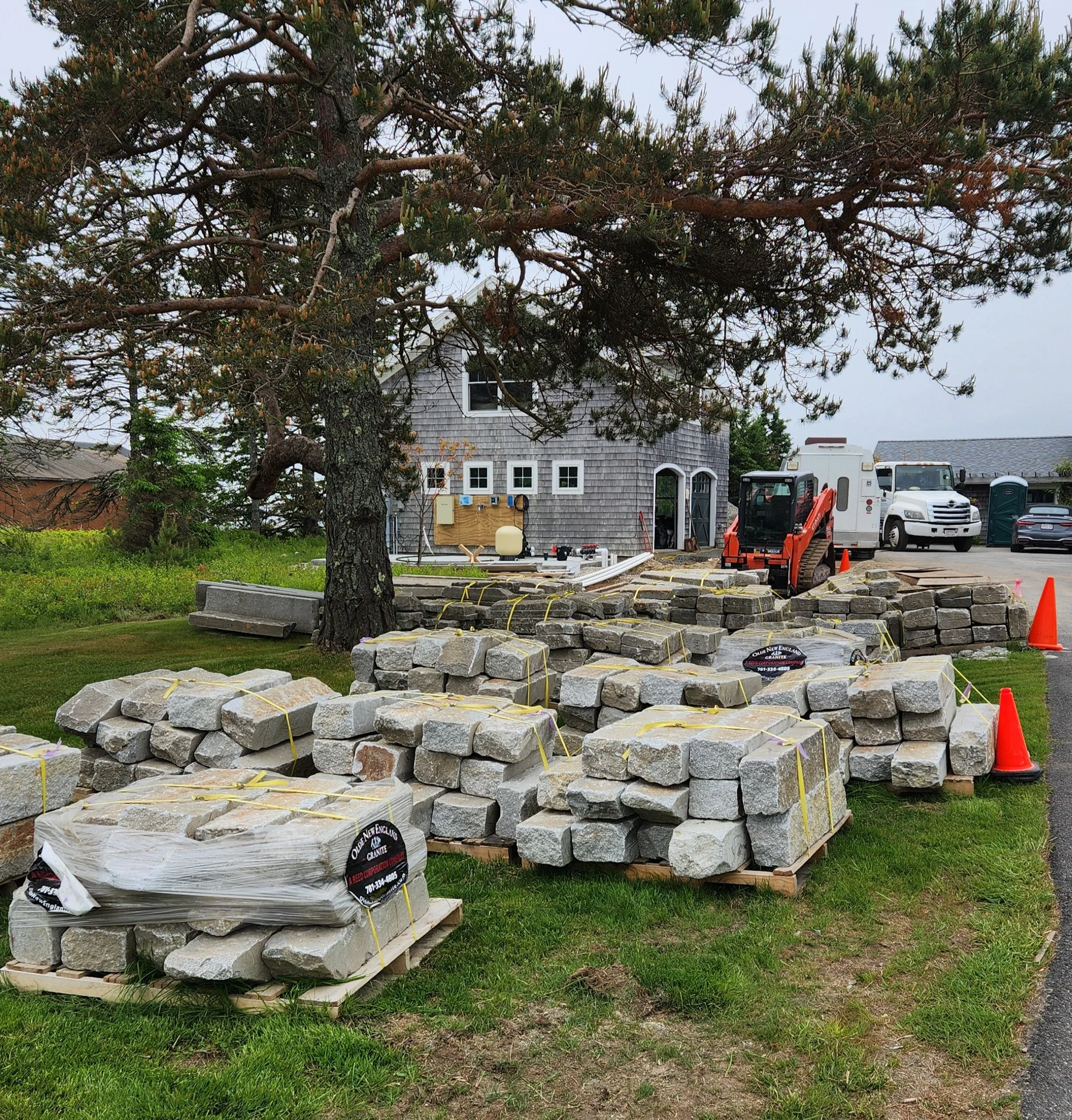 Stockpile of reclaimed granite curbing to be used as paving