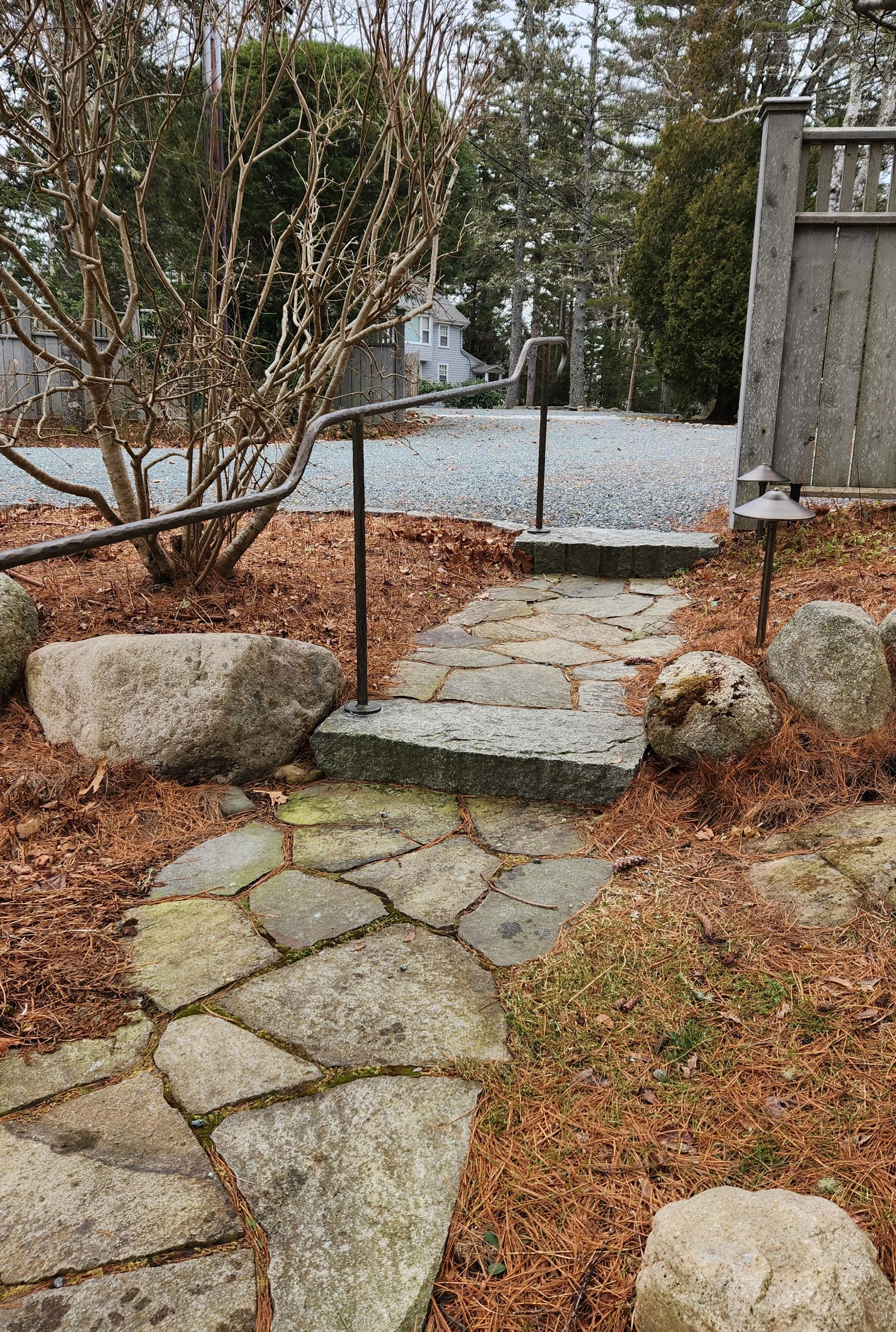 Stone walk with granite steps, lights and custom iron handrail