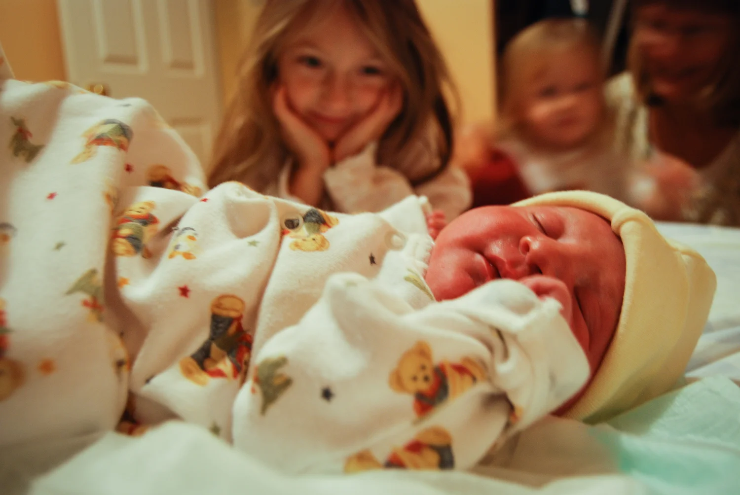 Rebekah Peurasaari meets her new baby sister Lydia Peurasaari for the first time after her home birth on Nov. 15, 2008 at their home in Bliss, MI.