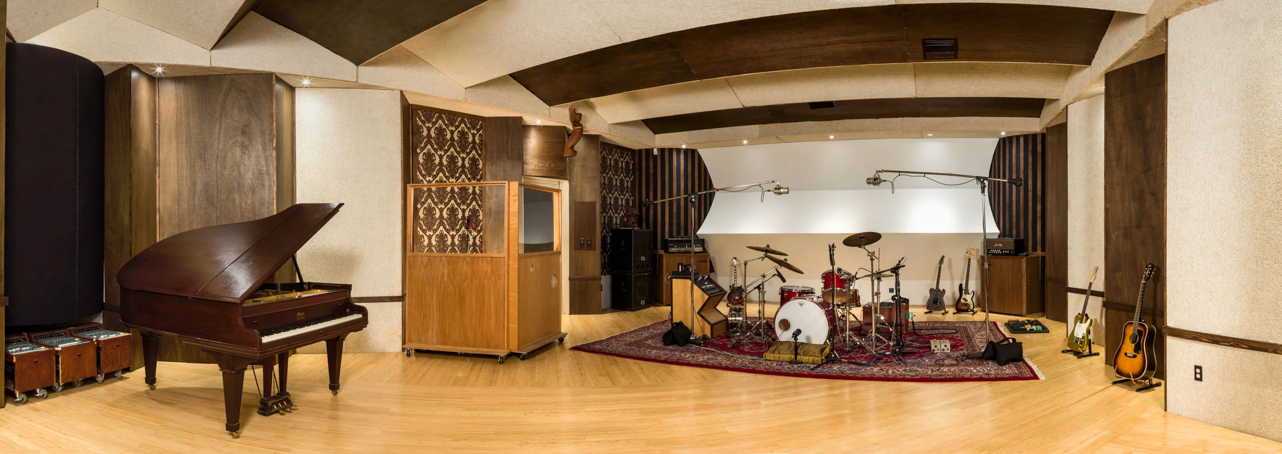 With a 1,000 Square feet of space and an incredible acoustic design & aesthetic, the tracking room at World Class Audio sounds as good as it looks. The tracking room is very controlled sonically and microphones are happily placed anywhere in the room with great results. Two isolated closets can tame 100 watt guitar amps down to a whisper while still being accessed directly in the room, and the doors can be opened to control "spill" into the room.