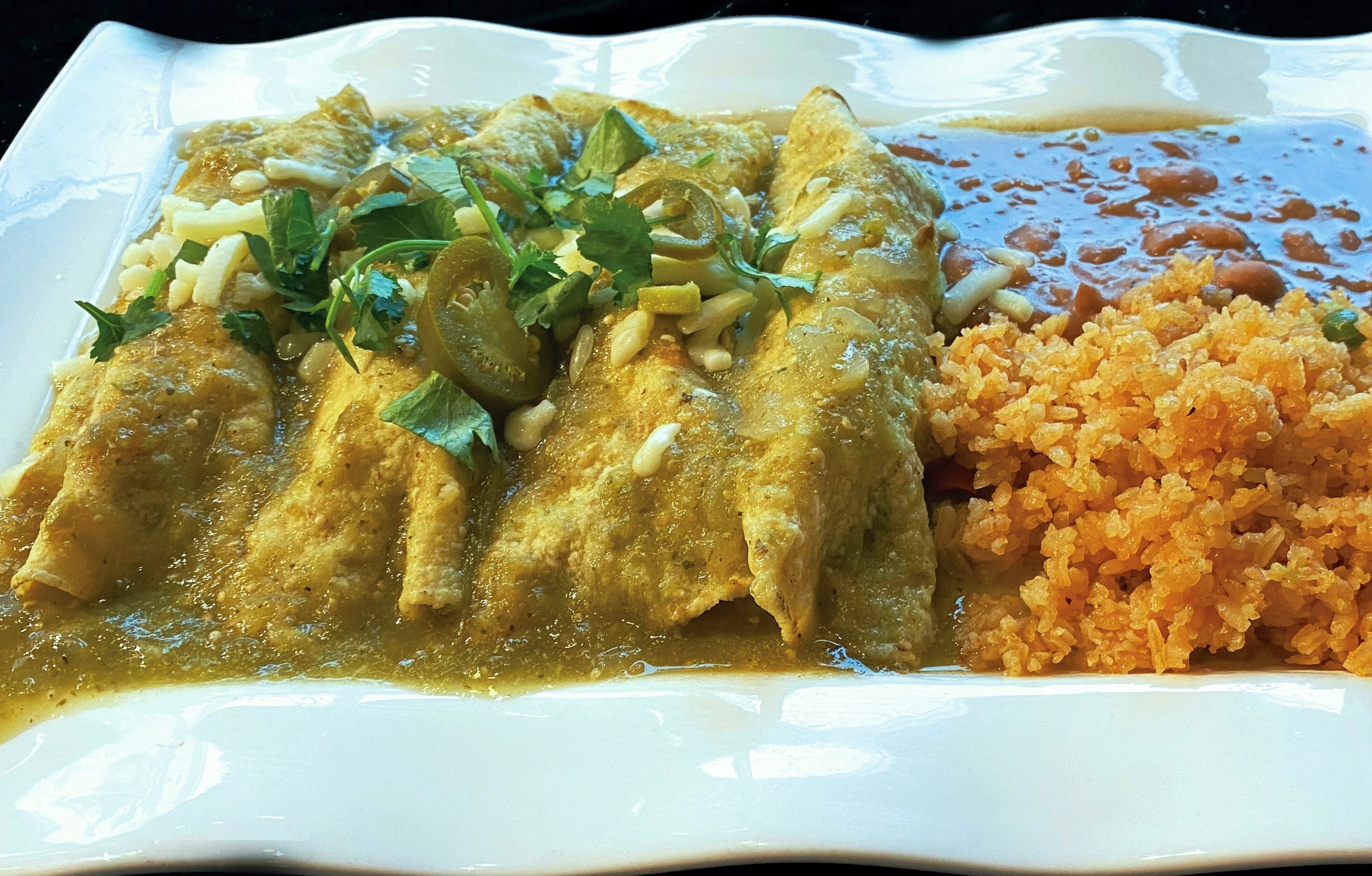 18.a.TOMATILLO SAUCE ENCHILADAS MEAL.Taco.Amigo.jpg