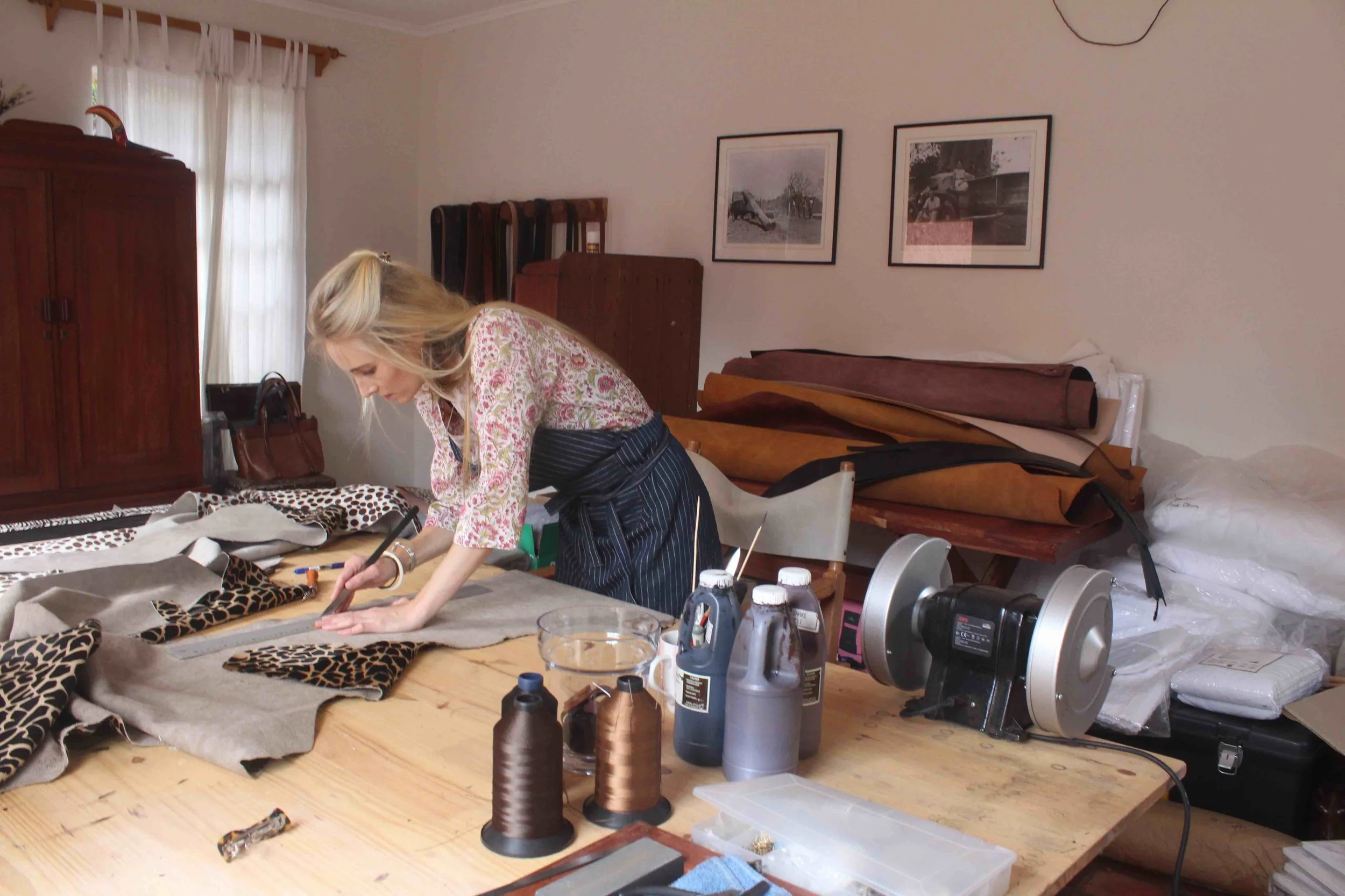  Justine working of a Giraffa and Soma print belt order. In the studio.
