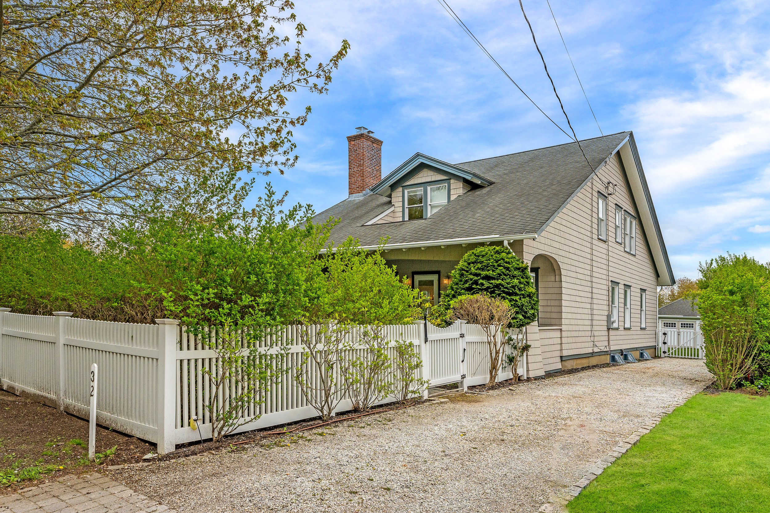 WebRes02_32 Butter Ln, Bridgehampton_Front-Angle + Driveway.jpeg