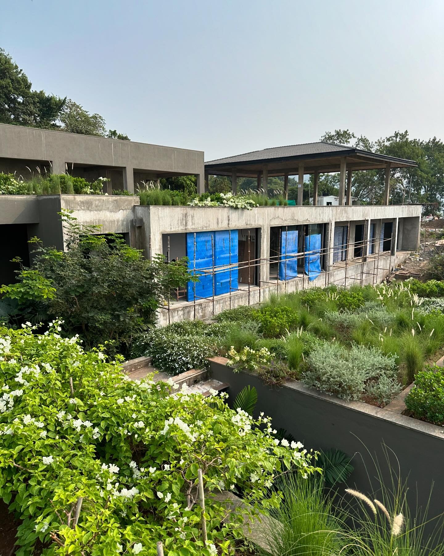 The roof terraces comprise a major component of the gardens around this vast house. Architects @casedesign.in have enabled planting on every structure where possible, giving a very green layered garden over the four levels of the building. In collab 