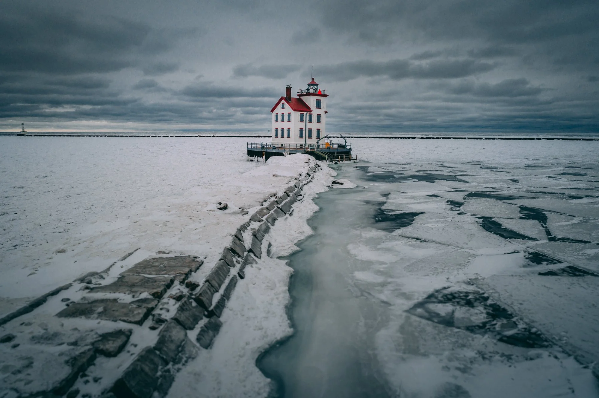 Lorain Lighthouse in winter - view from shore (by V1DroneMedia)