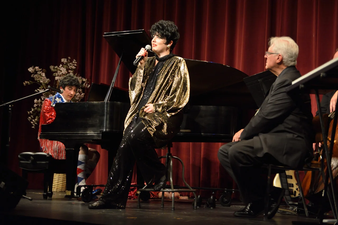 How did this happen?  A history of "a la Liberace!" in two acts
